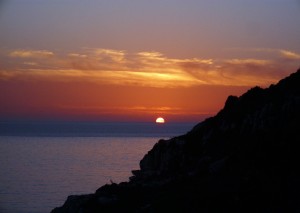 a great wiew of sunset, with blue and red colors at galazio beach in paxos island.